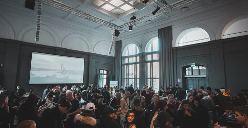 hall-filled-with-guests-for-corporate-event hall-filled-with-guests-for-corporate-event